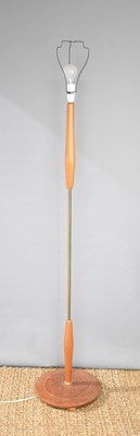 Lot 503 - A Mid-Century teak and brass standard lamp.