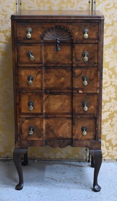 Lot 516 - A 1940s walnut veneered cabinet comprising...