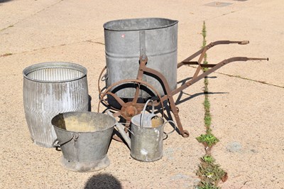 Lot 159 - A galvanised water carrier on a cast iron...