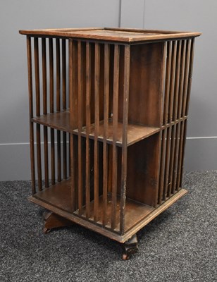 Lot 511 - A 1930s oak revolving bookcase, 89cm by 53cm...