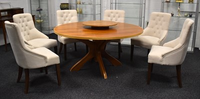 Lot 529 - A Mid-Century Ercol style circular top dining...