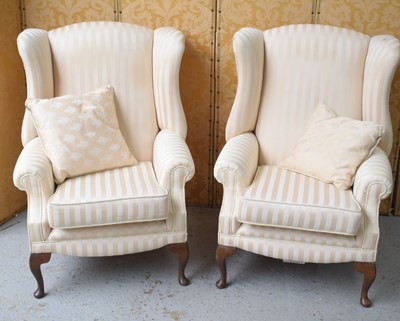 Lot 523 - A pair of country house style wingback...