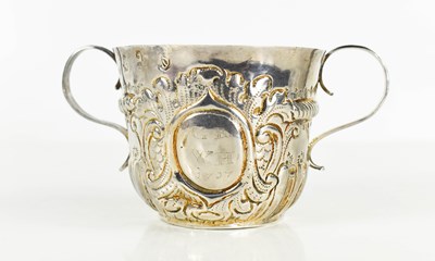Lot 134 - A Queen Anne period twin handled silver cup,...