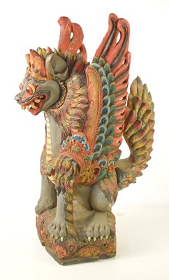 Lot 102 - A Balinese polychrome and gilt wood sculpture...