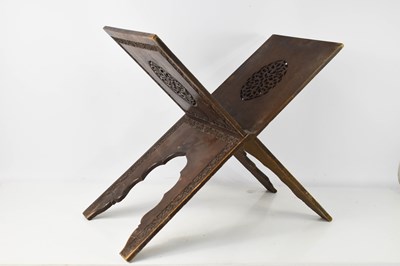 Lot 157 - A late 19th century hardwood folding Quran...