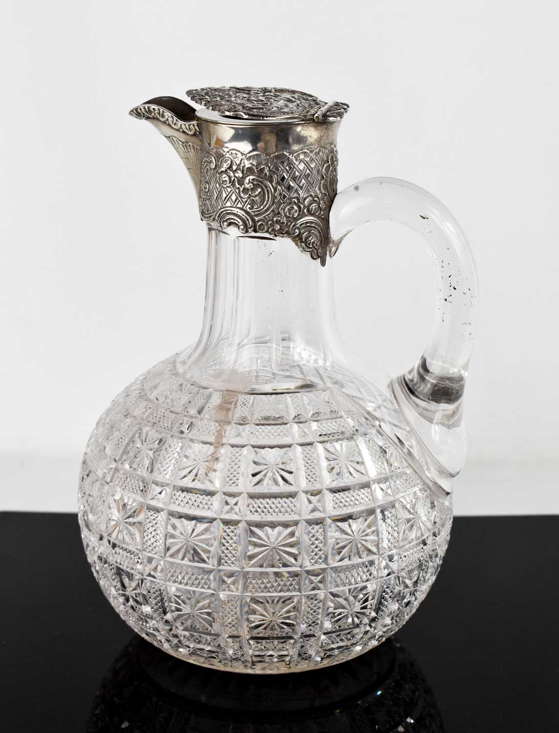 Lot 273 - A 19th century silver and glass claret jug,...