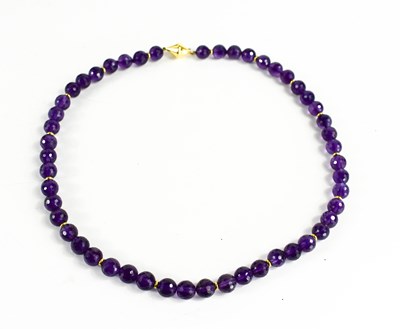 Lot 11 - An 18ct gold and amethyst necklace the fifty...