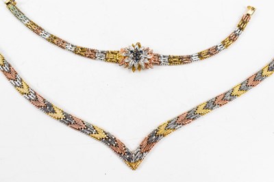 Lot 42 - A tri-colour herringbone necklace marked 9...
