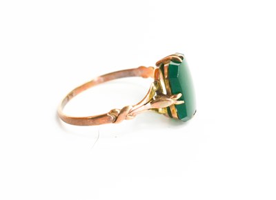 Lot 80 - A 9ct gold and jade set ring, size M, 1.3g.