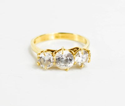 Lot 83 - An 18ct gold and white three stone ring,...