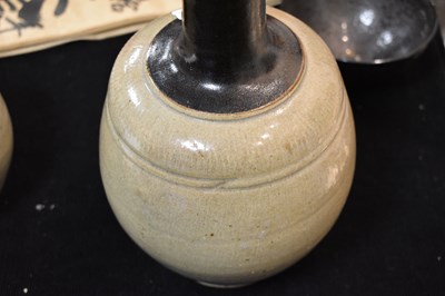 Lot 20 - A Chinese stoneware bottle vase, with dark...