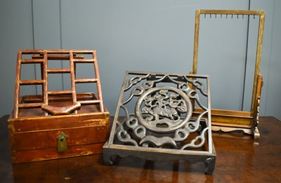 Lot 151 - A Chinese book stand, the carved fretwork...