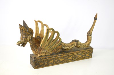 Lot 134 - A Balinese carved wooden winged lion box, the...