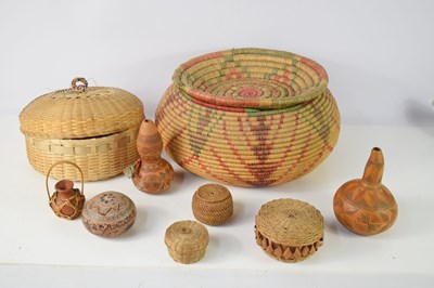 Lot 255 - An African bot belly woven basket together...