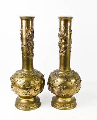 Lot 106 - A pair of Chinese bronze vases, the bodies...