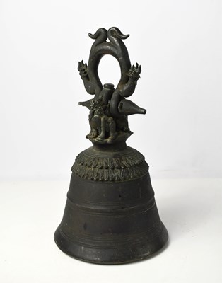 Lot 110 - A Tibetan bronze bell, cast with two dragons...