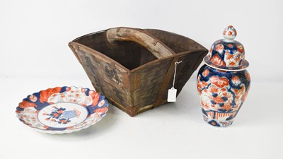 Lot 243 - A Chinese rice bucket, having character marks...