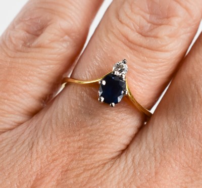 Lot 258 - An 18ct gold sapphire and diamond wishbone...