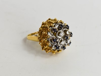 Lot 20 - A gold, diamond and sapphire cluster ring,...