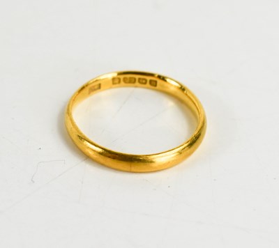 Lot 82 - A 22ct gold wedding band, size L, 2.6g.