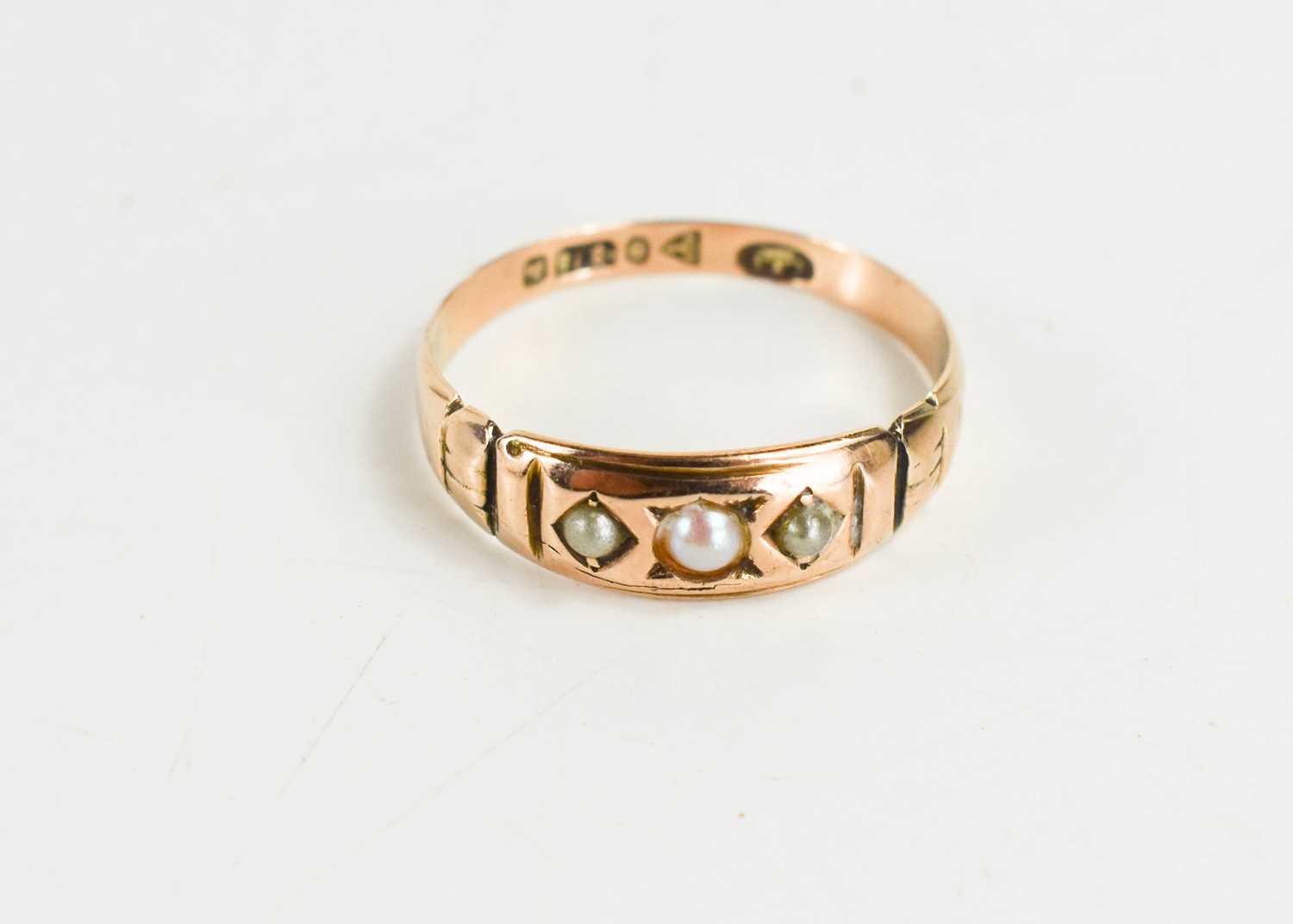 Lot 44 - A 9ct gold and seed pearl ring, the three seed...