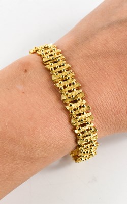 Lot 16 - A 9ct gold bracelet, composed of modernist...