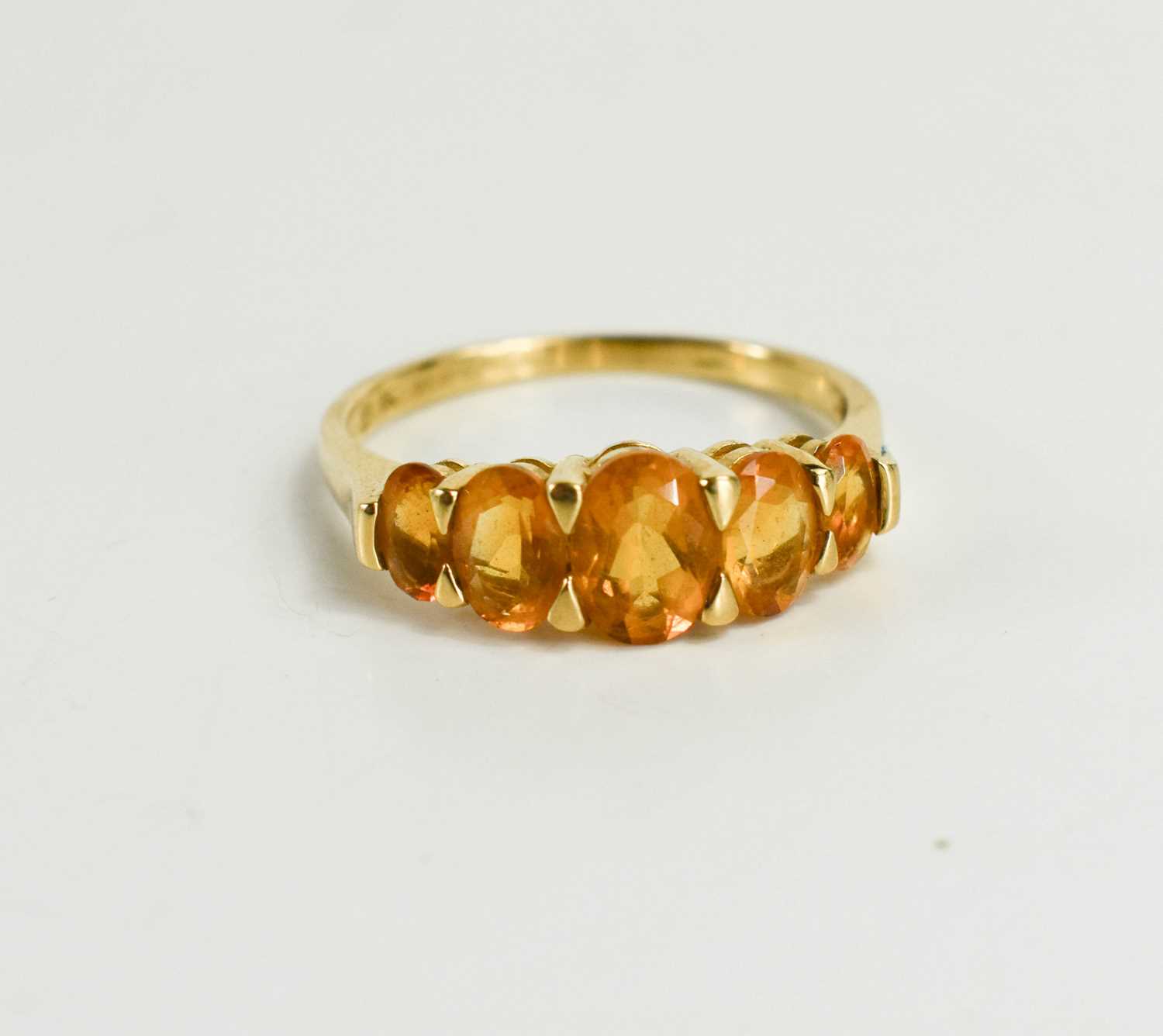 Lot 95 - A 9ct gold and citrine five stone ring, the...