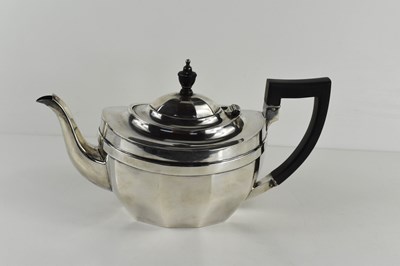 Lot 405 - A 19th century silver teapot, with ebonised...