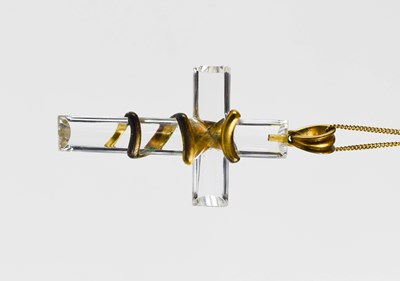 Lot 15 - A rock crystal and gilt metal pendant in the...