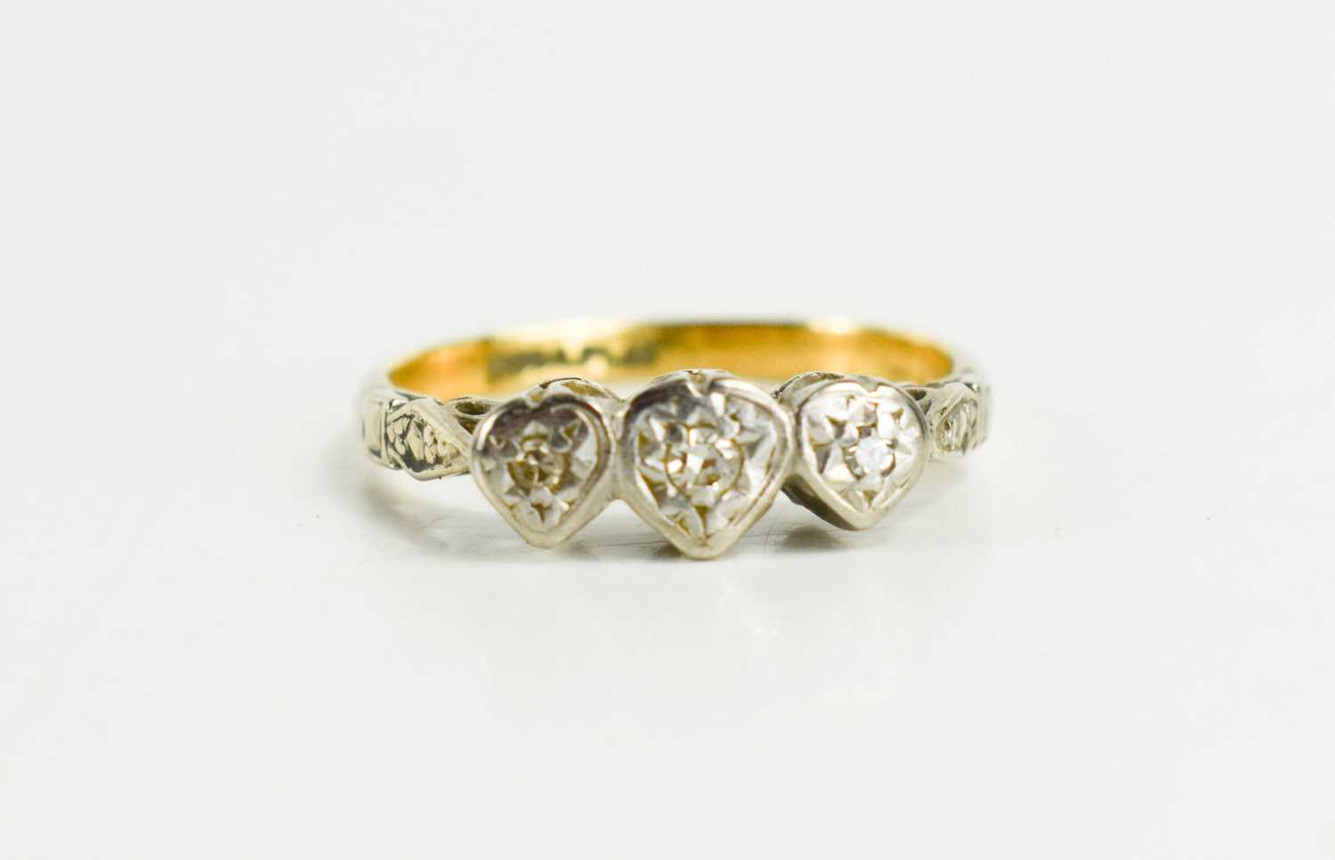Lot 96 - An 18ct gold and platinum diamond ring, set in...