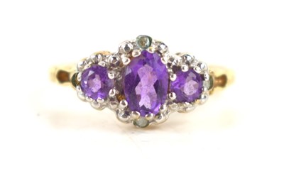 Lot 35 - A 9ct gold and amethyst ring, the three oval...