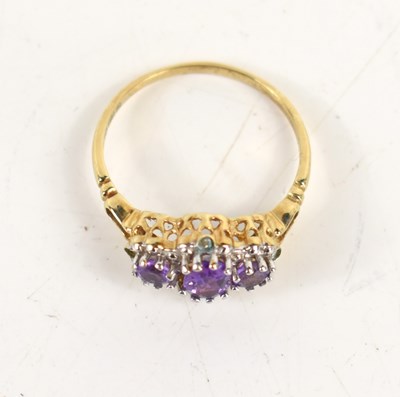 Lot 35 - A 9ct gold and amethyst ring, the three oval...