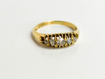 Lot 120 - An 18ct gold and diamond set five stone ring,...