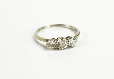 Lot 10 - A diamond three stone ring, the central stone...
