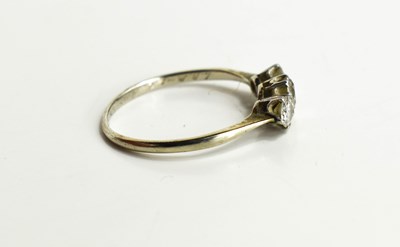 Lot 10 - A diamond three stone ring, the central stone...
