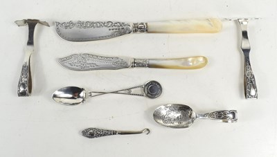 Lot 361 - A group of silver to include two silver fish...