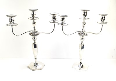 Lot 417 - A pair of Edwardian silver candlesticks with a...