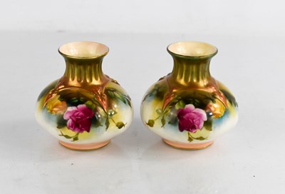 Lot 113 - A pair of Royal Worcester vases painted with...