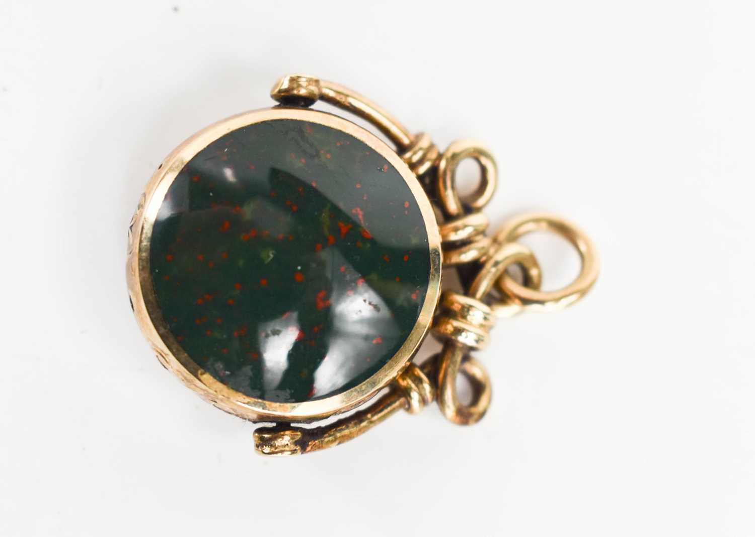 Lot 38 - A 9ct gold swivel fob, set with bloodstone and...