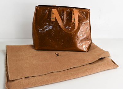 Lot 61 - A Louis Vuitton copper coloured patent leather...