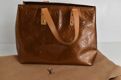 Lot 61 - A Louis Vuitton copper coloured patent leather...
