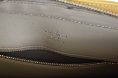 Lot 62 - A Louis Vuitton gold coloured patent leather...