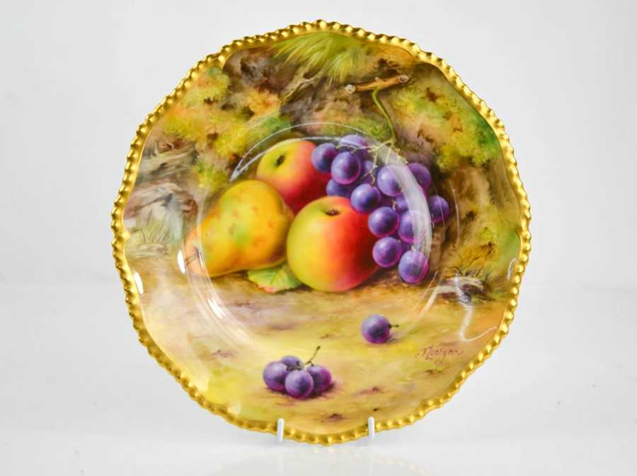 Lot 34 - A Royal Worcester plate painted with fruit on...