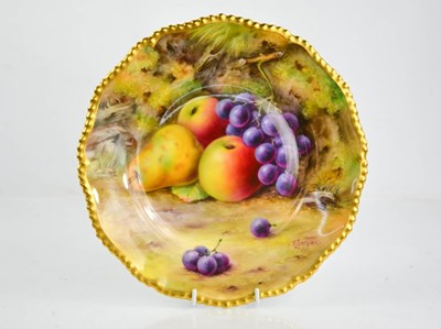 Lot 34 - A Royal Worcester plate painted with fruit on...