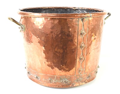 Lot 327 - An antique copper cauldron with riveted seams...