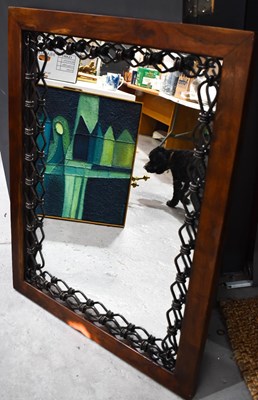 Lot 395 - An interesting wall mirror with iron link...