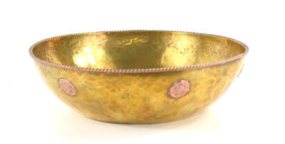 Lot 250 - An Arts and Crafts brass bowl with gadrooned...