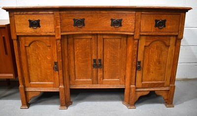 Lot 496 - An early 20th century Arts and Crafts oak...