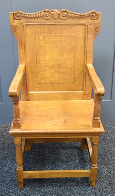 Lot 494 - An Arts and Crafts style oak hall chair with...