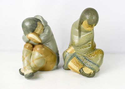 Lot 174 - A pair of Lladro porcelain Inuit figures...